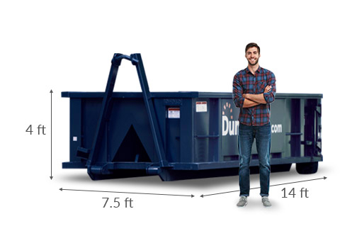 A man standing near a 15 yard dumpster showing dimensions of 14 feet x 7.5 feet x 4 feet.