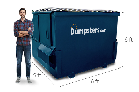 Man standing next to a 6 yard dumpster with dimensions of 5 feet x 6 feet x 6 feet