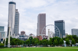 The Atlanta skyline with a Ferris wheel and park in the foreground