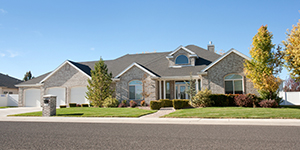 a ranch style house under a blue sky