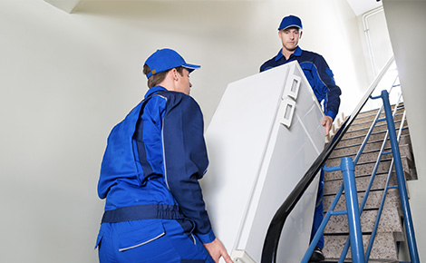 Junk removal service removes an old fridge.