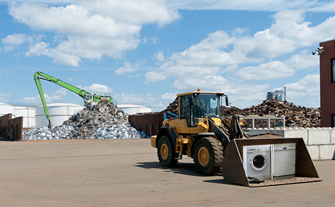 Front loader with an appliance in the shovel.