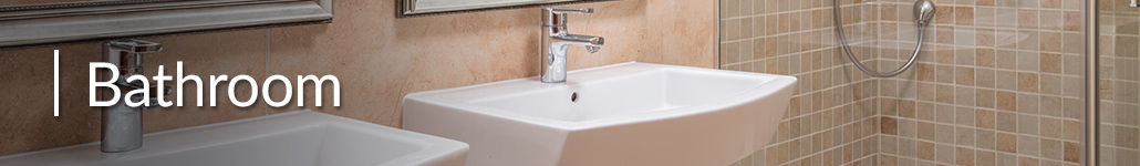 Two sinks with lever handles and a tiled walk-in shower.