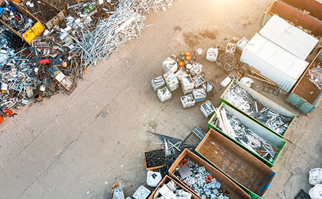 Recycling center with separate containers for different types of materials.