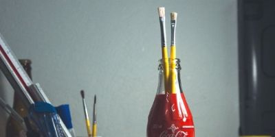 Reusing a Coke bottle as pencil holder.