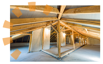 An unfinished attic filled with wooden beams and joists