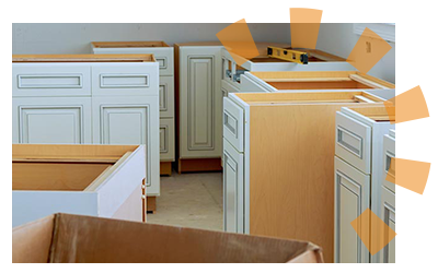 White base cabinets pulled away from the wall.
