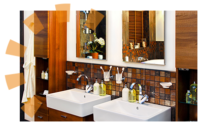 A dual-sink bathroom with items on the sink and shelves.