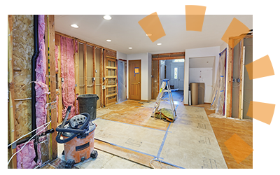 A room with drywall missing with demolition supplies.