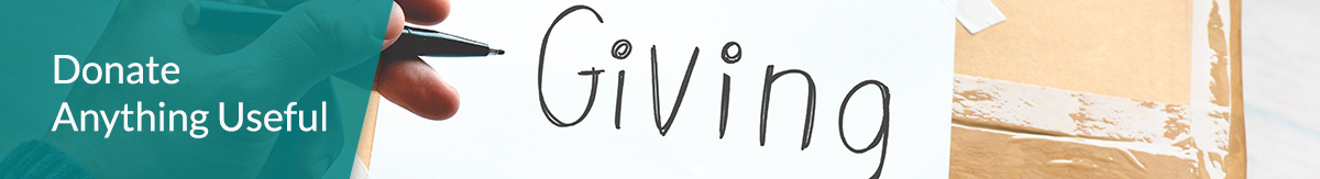 A cardboard box with the word 'giving' written on top.