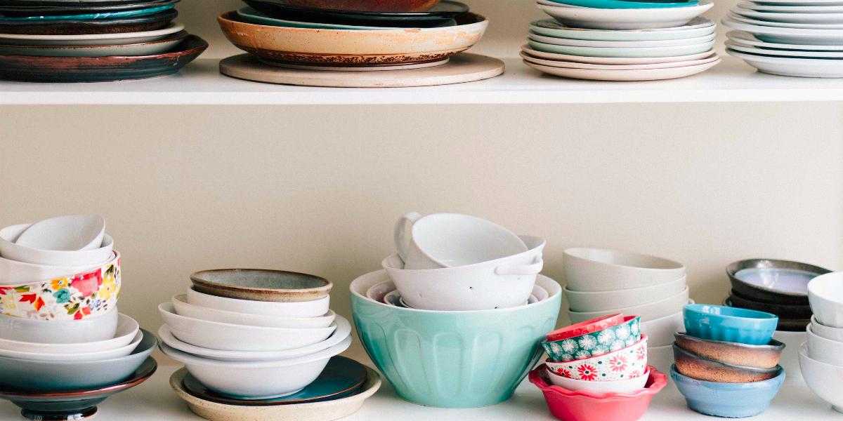Kitchen cabinet that needs to be organized.