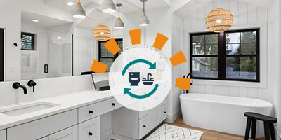 Beautifully remodeled bathroom with newly installed wood flooring, white cabinetry and modern black hardware.