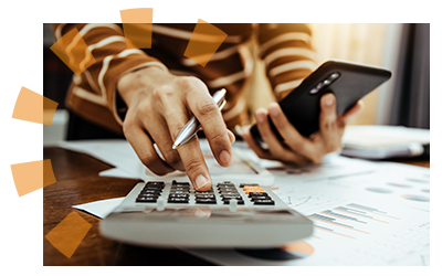 A person holding a pen and using a calculator to budget for barn demolition.