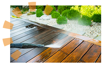 A pressure washer being used to clean the exterior of a foreclosure.