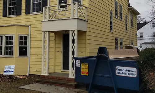 A home restored by the Cleveland Restoration Society with a Dumpsters.com dumpster out front. 