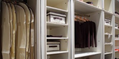 Organized master bedroom closet.