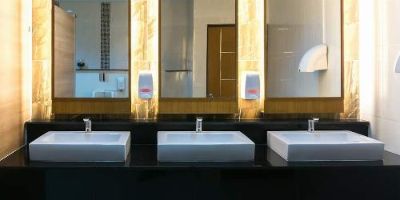 Commercial Restaurant Bathroom With Three Modern Sinks and LED Lighting