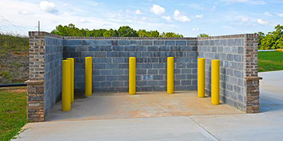 Concrete commercial dumpster corral. 