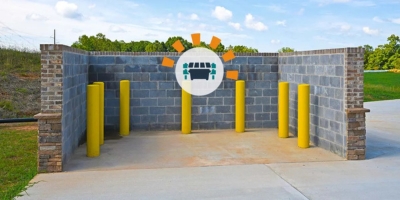 Concrete commercial dumpster corral. 