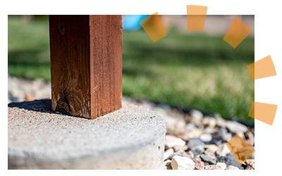 Wooden deck beam resting on a concrete support post for stabilization.