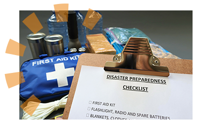 A checklist for disaster preparedness with emergency equipment in the background.