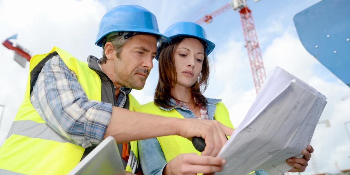 Construction Workers Reviewing Quality Plans