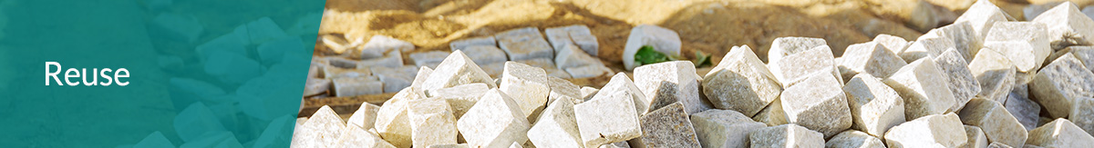 A pile of paving stones salvaged for future reuse.