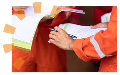 A construction worker reviewing the appropriate permits. 