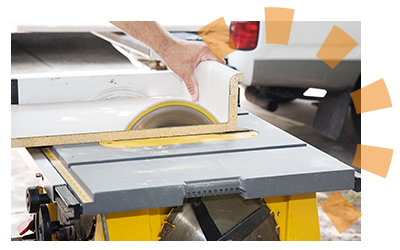 White laminate countertops being cut with a saw.