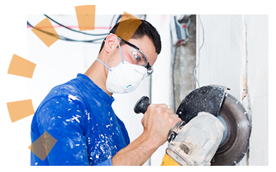 Male contractor cutting drywall with professional saw.