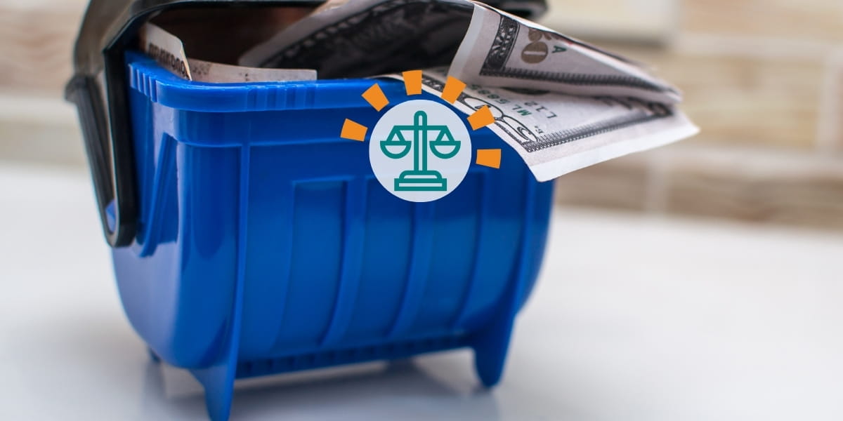 Blue toy dumpster with cash inside.