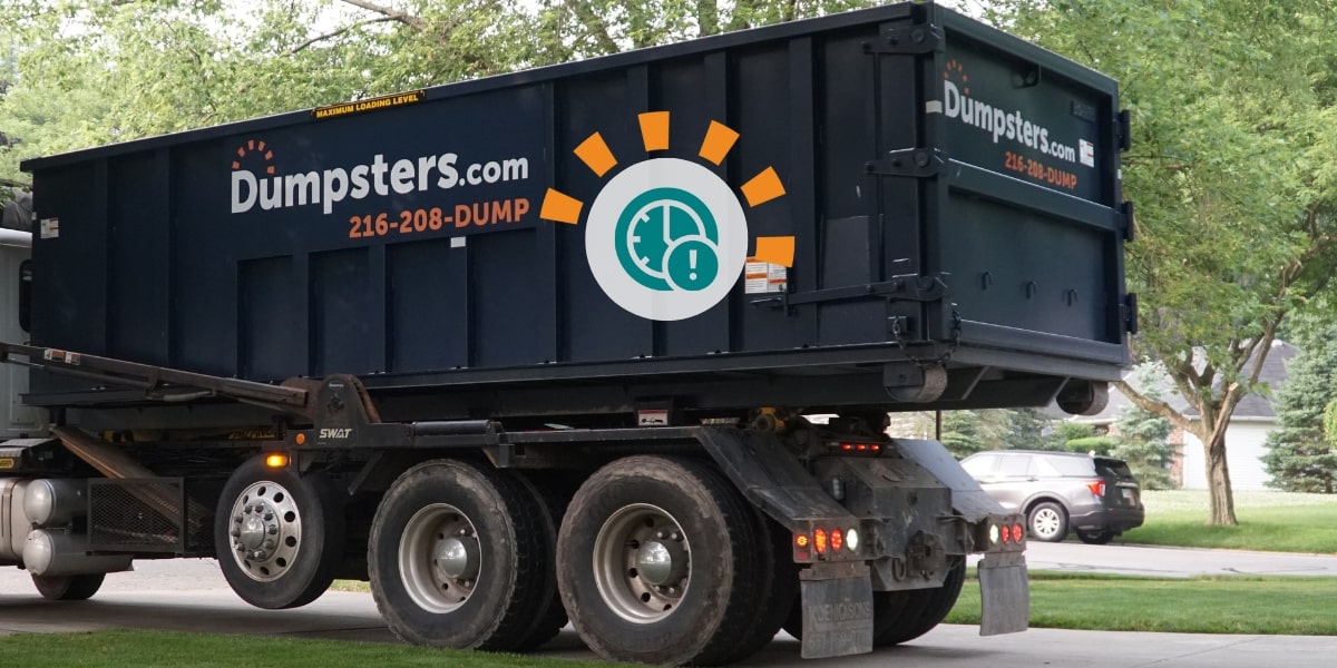 Dumpsters.com Dumpster on Truck With Icon of Clock and Exclamation Mark