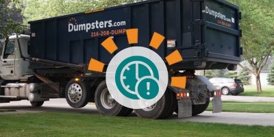 Dumpsters.com Dumpster on Truck With Icon of Clock and Exclamation Mark