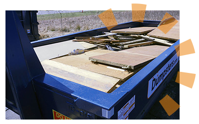 Dumpsters.com Dumpster Filled With Wood Panels.