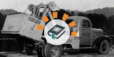An image of Dempster's original dumpster and truck.