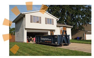 Dumpsters.com roll off dumpster in driveway.