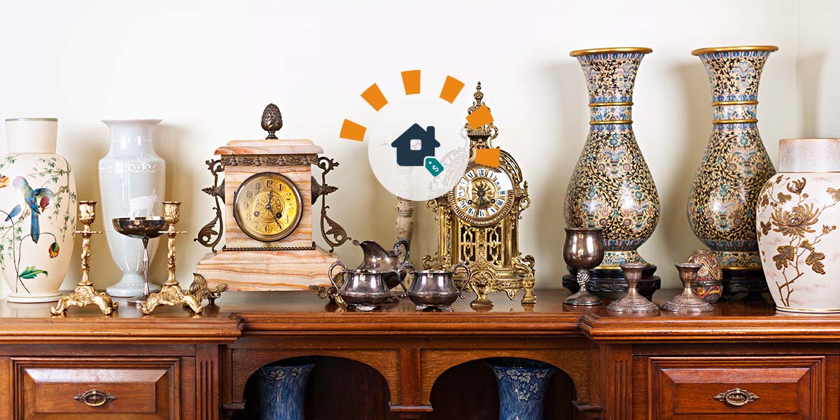 Estate sale with valuable, antique clocks, vases, candlesticks, cups and wooden dresser.