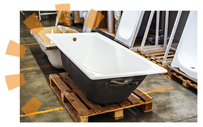 A cast iron bathtub sitting in a restoration store.