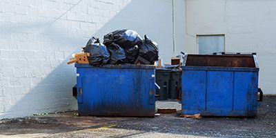 Two Overfilled Dumpsters