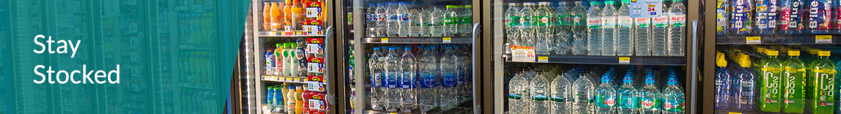 A well-stocked cooler aisle at a convenience store.