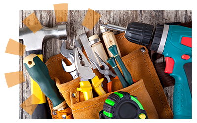 A hammer, work belt, drill and tape measure on a table to help clean out a foreclosed home. 