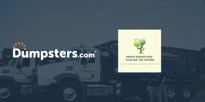 Construction worker in an orange vest and white helmet holding a cellphone to their ear on an active jobsite, with the Dumpsters.com orange radial arc overlaid.