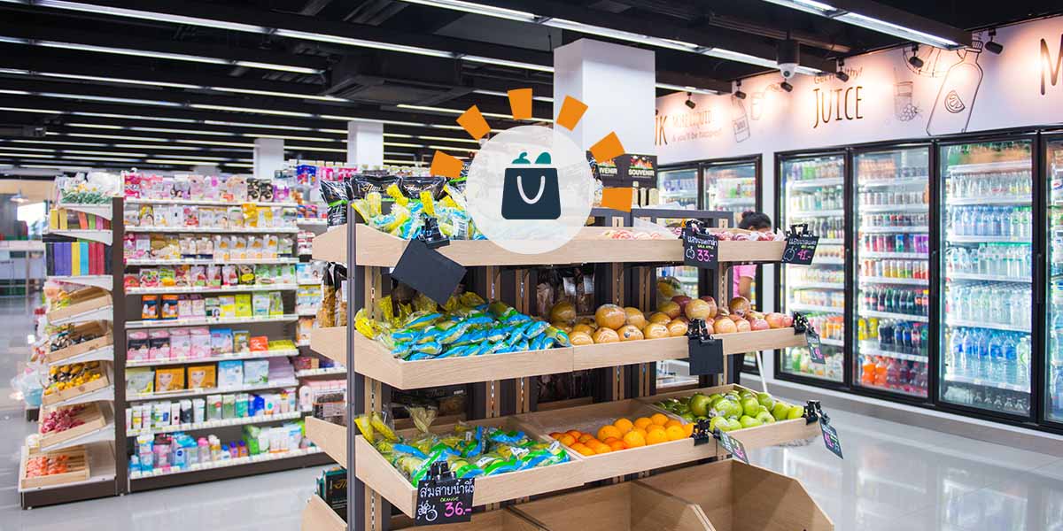 A modern grocery store vegetable section.