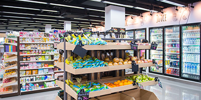 A modern grocery store vegetable section.