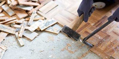 hammer and crowbar removing floor