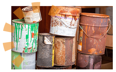 A collection of prohibited hazardous paint cans. 