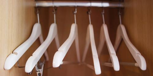 Coat hangers in a hall closet.