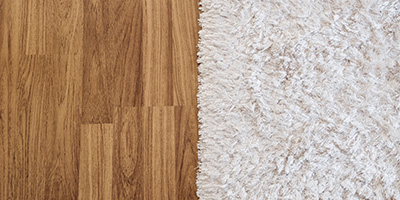 Hardwood vs. carpet flooring side-by-side for homeowner to pick.