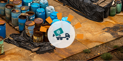 Rows of hazardous waste barrels.