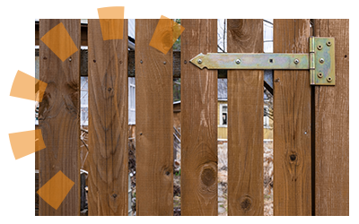 Old brown fence with metal gate hinges needing removed.